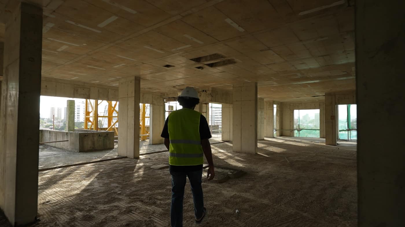 Site walk on a cast slab, Fairway Latitude, August 2026