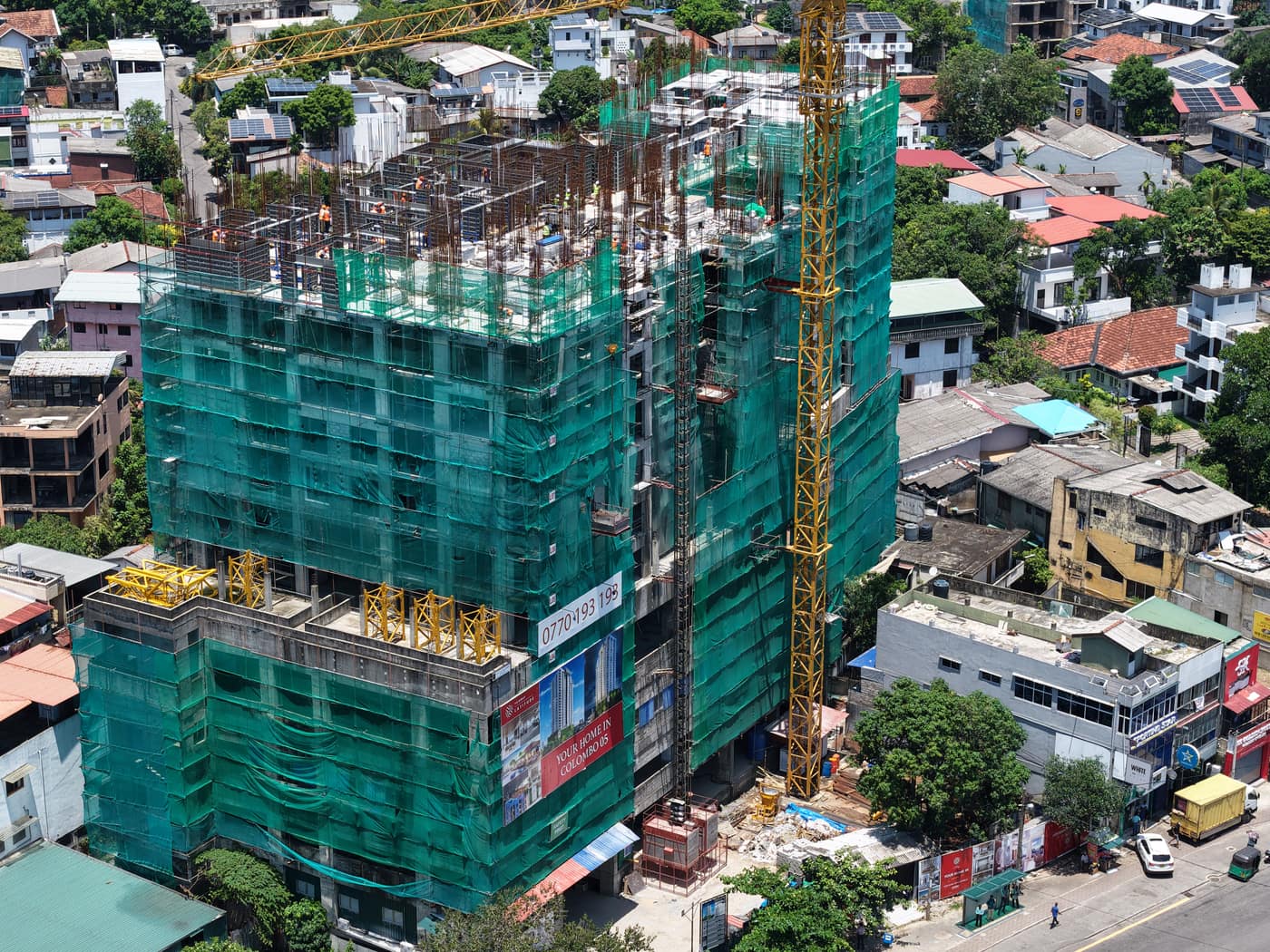 Street-side view with the tower crane, Fairway Latitude, September 2026
